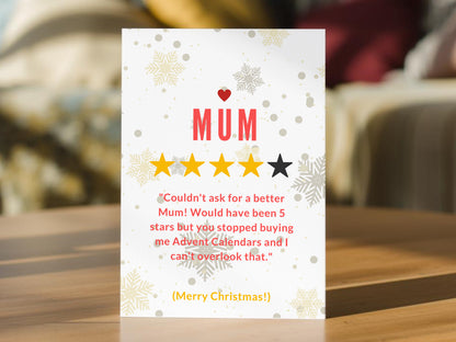 Funny Mum Christmas card with five-star rating design, snowflakes and joke about Mum stopping buying Advent calendars.