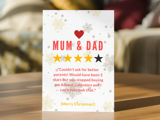 Funny Christmas card for Mum and Dad with five-star review design, snowflakes and Advent calendar joke.